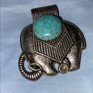 Elephant with blue stone necklace